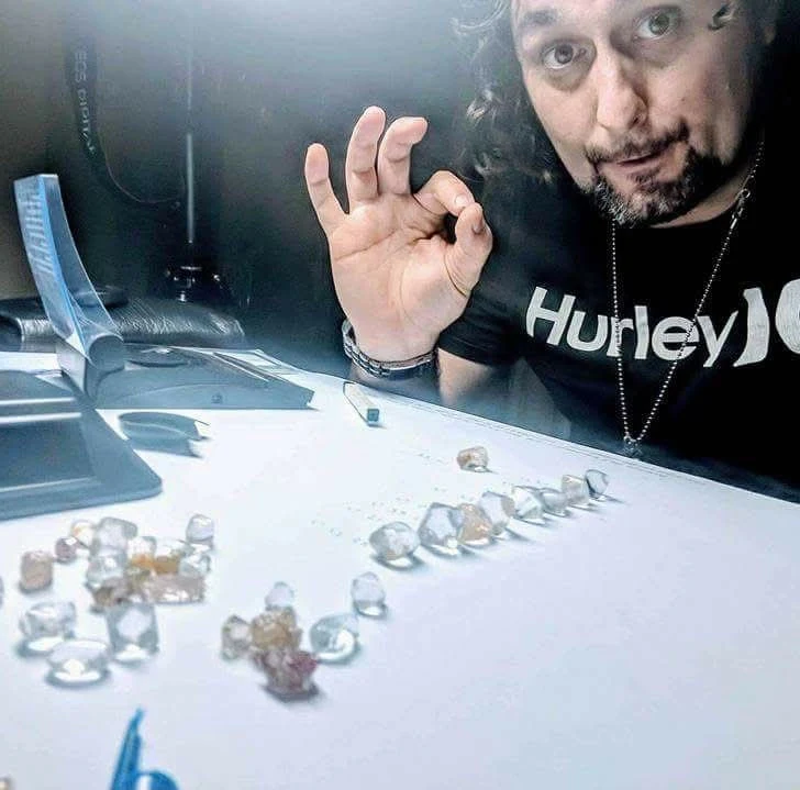 Eliahi examining rough stones